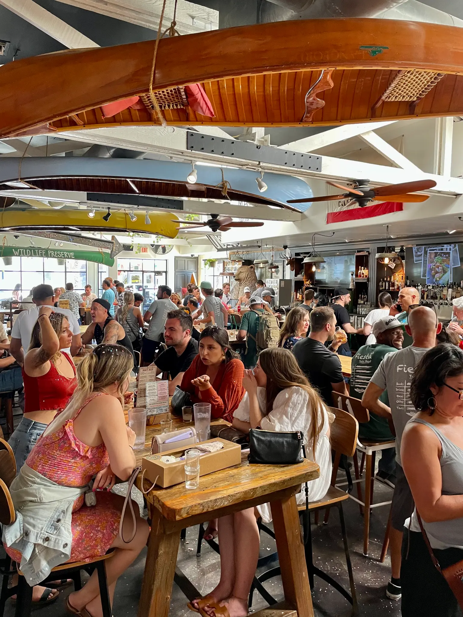 Packed crowd at Unbearable Skee Lodge during a fiesta-themed bachelorette party